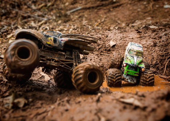 fun in the mud with my boy's toy monster trucks